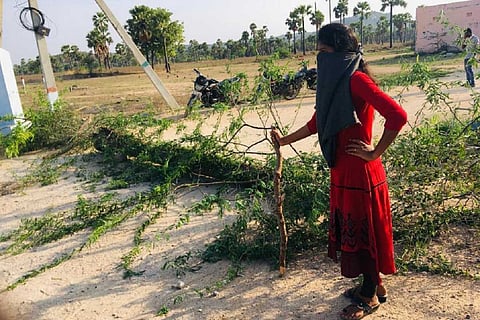 Telangana sarpanch stands guard outside her village