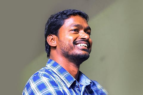 Poet Gopal in a checked-shirt