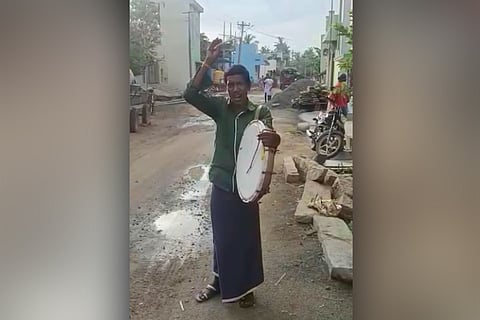 A person making an announcement using a thandora