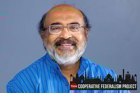 Kerala Finance Minister Thomas Isaac wearing a blue kurta smiling