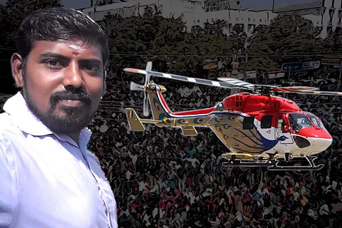 South Madurai candidate Thulam Saravanan with a helicopter and a crowd in the background