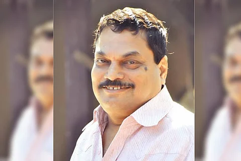 BA Raju in a pink shirt
