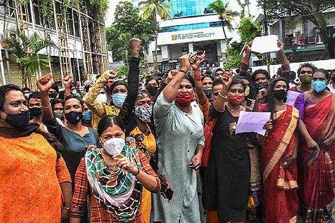 Trans women protesting in front of a hospital