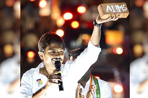 Udhayanidhi holds brick in hand