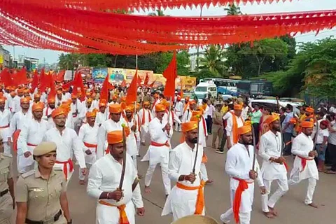 Hindu Jagarana Vedike march in Udupi, men wearing white kurtas and saffron turbans are marching holding flags and swords