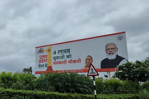 A picture of the Uttar Pradesh government hoarding which has PM Modi and Yogi Adityanath on it shared by Bengaluru lawyer