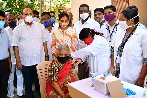 A woman being vaccinated as part of the drive