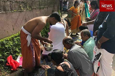 Kerala rains: As temple remains submerged in Aluva, devotees offer 'Bali' on roads