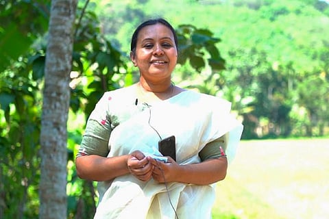 Kerala Health Minister Veena George posing for a picture
