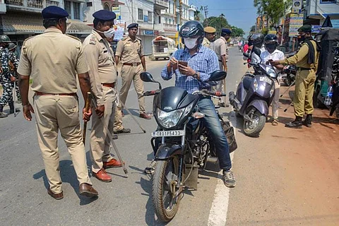 A violator paying the fine to a police officer