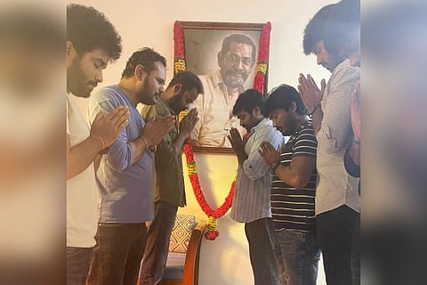 Vijay Sethupathi along with members from 'Laabam' crew are seen praying and paying respect to late director Jananathan's potrait.