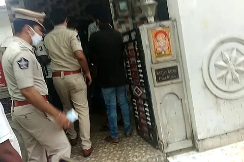 Police entering the house of the murder victims in Pendurthi in Vizag