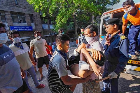 A boy affected by the Vizag gas leak being rescued