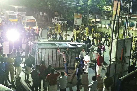 An image of an overturned vehicle at the Vizhinjam protest