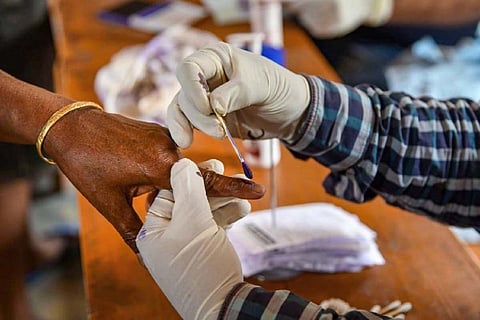 Representative image of a person being inked after casting their vote at an election in India