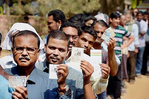Voters wait to exercise their franchise during polls.