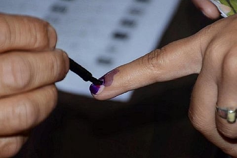 A person getting their finger inked during elections