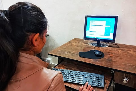 Woman working in front of computer