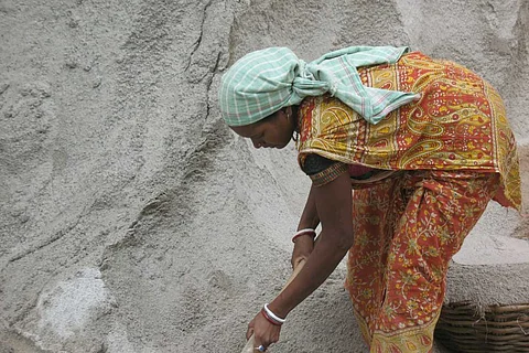 A woman labourer at work on a construction site