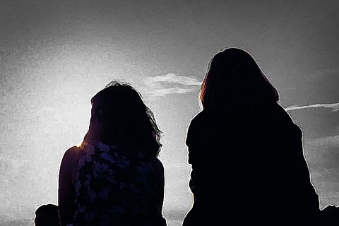 Silhouette of two women