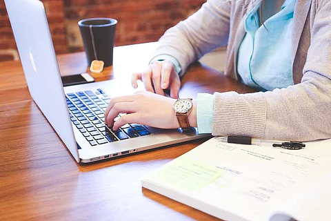 A representative picture of a person at a work desk