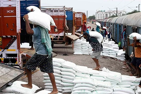 Labourers at a railway station.