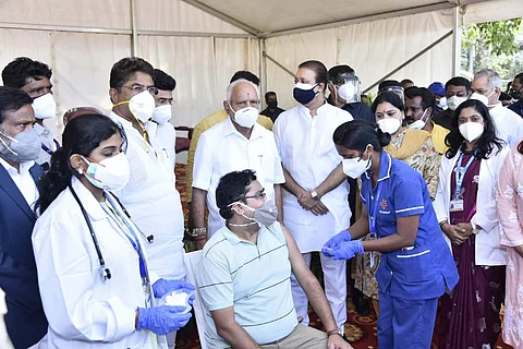 CM BS Yediyurappa along with Minister R Ashoka in a vaccination camp in Bengaluru
