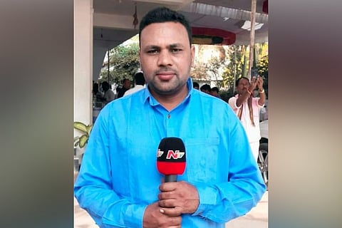 Zameer, NTV reporter, wearing a blue shirt and holding a mic