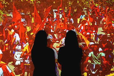 A representative picture of right wing groups in the background and silhouette of two young women in the foreground.