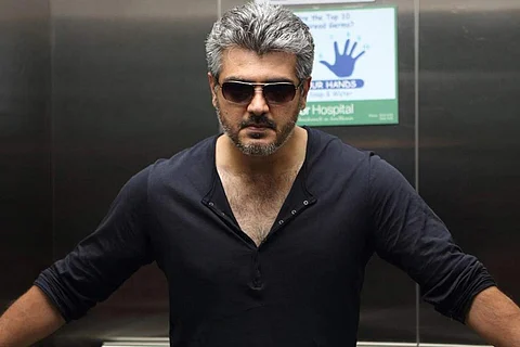 Ajith in a black T shirt and black sunglasses