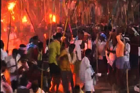 Devotees fighting with sticks as part of the Banni festival