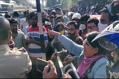 A woman expresses her frustration after being stuck in traffic for over an hour on December 8