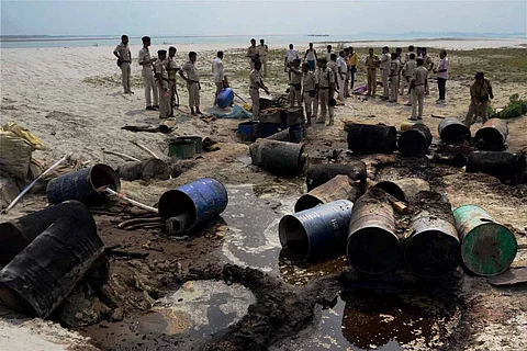 Representative image of police destroying country-made liquor