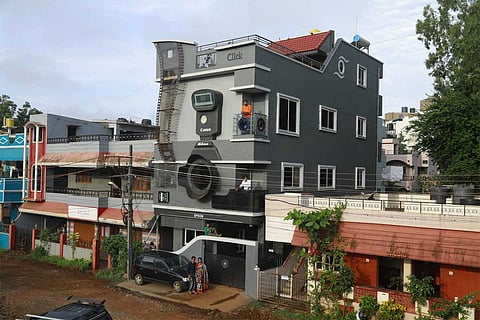 After naming sons Canon, Nikon and Epson, photographer builds camera-shaped house