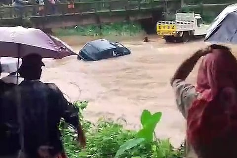 Watch: Dramatic escape for driver of car towed across flooded Kerala stream