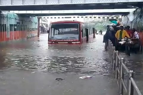 A bus in a flooded underpass after heavy rains in Chennai