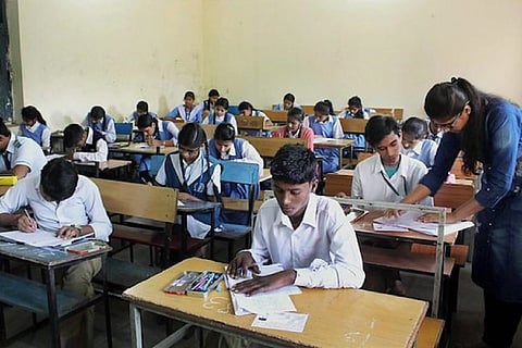 Image of students writing exams