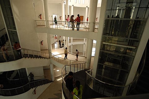 Inside a college where students are seen on various floors