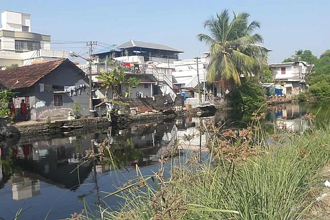 Houses on the banks of a canal in Kochi
