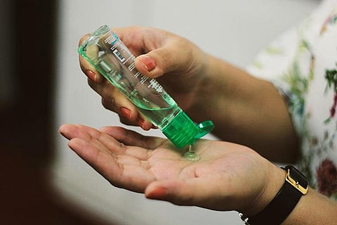 Representational image of a person applying sanitiser