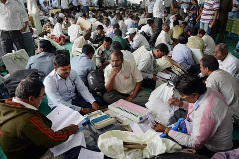 Several people counting votes