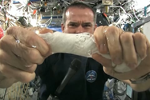 What happens when you wring out water in space: Watch this awesome video