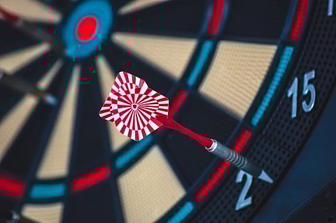 Why the dartboard looks like it does, and how bad players can do better