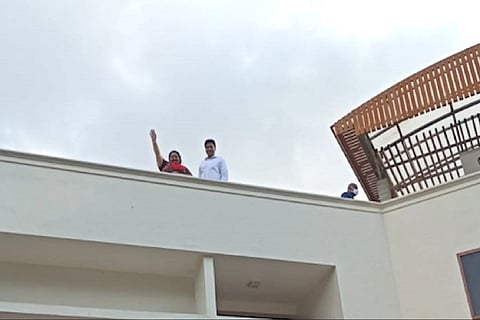 Deepa and husband Madhavan greet media at Jayalalithaa's Poes Garden home