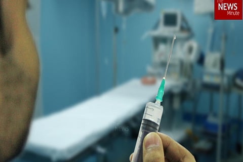 A doctor with a syringe