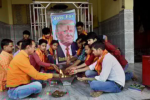 As the US goes to polls, Trump and Clinton supporters in India turn to prayer