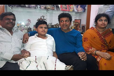 Actor Shiva Rajkumar visits young fan who lost his leg in an accident