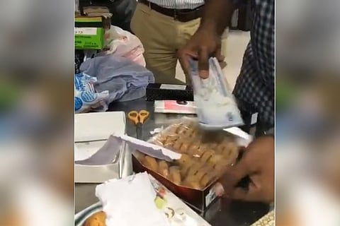 Watch: Foreign currency worth Rs 1.48 cr being smuggled in biscuit boxes seized in Hyd