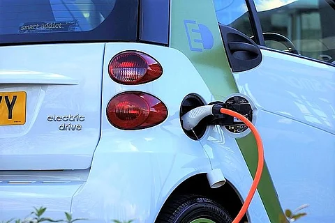An electric vehicle being charged