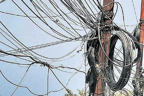 Cable wires hanging from a transformer
